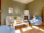 Ferienwohnung 03 'Rehhagen' - Wohnbereich mit gemütlichem Kamin